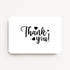Liggende witte bedankkaart met zwarte tekst "Thank you!" en kleine hartjes.