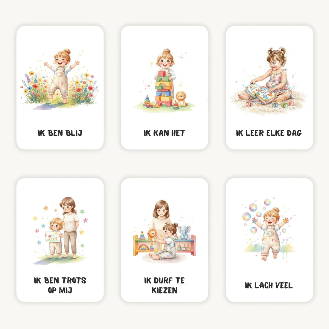 Flatlay van zes affirmatiekaarten met aquarelillustraties van meisjes op een lichte achtergrond, zacht en dromerig weergegeven.