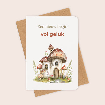 Felicitatiekaart voor een nieuwe woning met paddenstoelenhuis en kraftenvelop