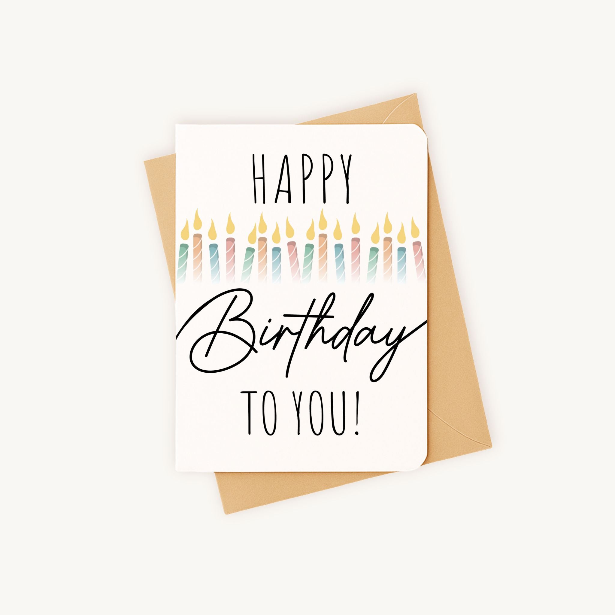 Verjaardagskaart kaarsjes liggend met kraft envelop