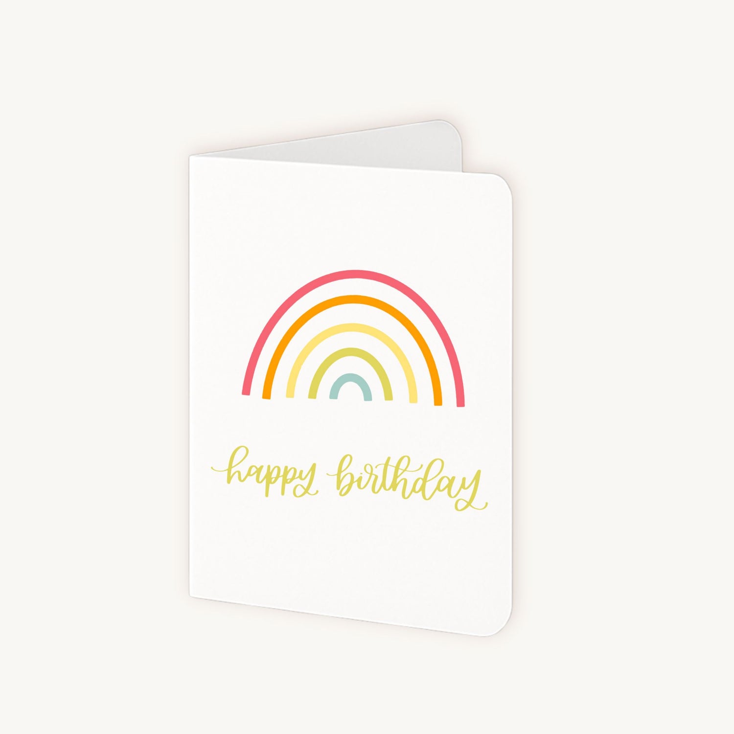 Half geopende verjaardagskaart met regenboog en witte binnenkant